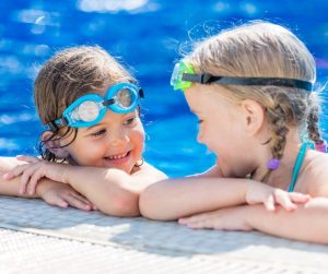 Children practicing water confidence during a semi-private swim lesson